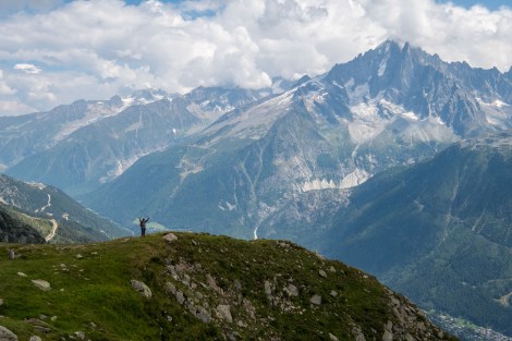A mini-dad surrounded by large mountains