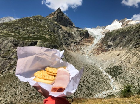 Lunch of ham, cheese and crackers near Rifugio Elena overlooking Glacier de Pre de Bar, Mont Dolent and Aiguille de Triolet