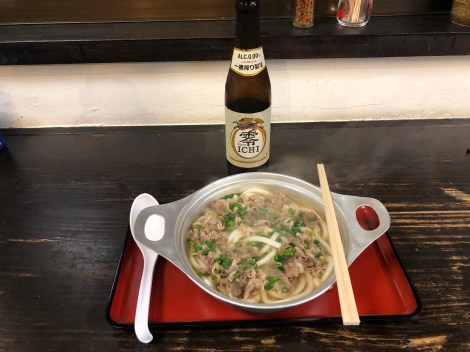 Dinner in Matsuyama of hot beef with udon noodles and a Kirin alcohol-free beer