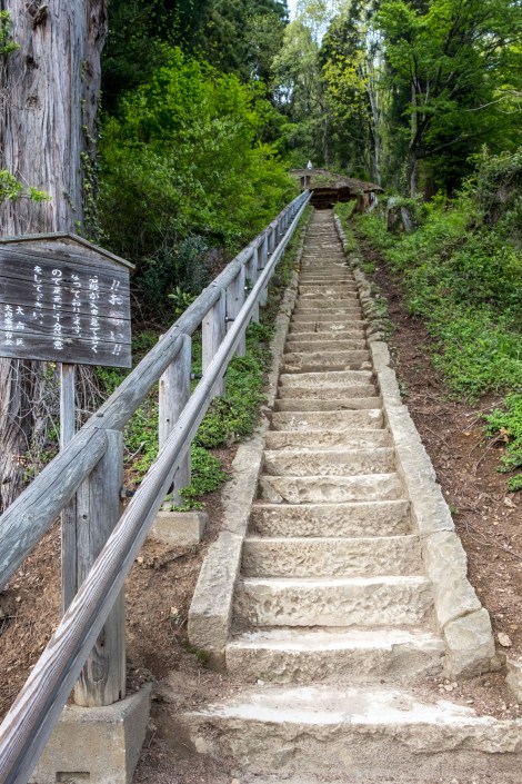 Taking the stairs up to a viewpoint overlooking the old Edo post-town of Ouchi-juku