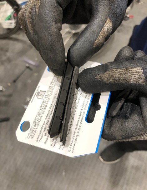 Getting new back brake pads fitted after the spoke was fixed at Asahi Cycle Base in Tomakomai