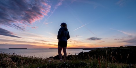 KC watching the sunset on day 4 of our Pembrokeshire Coast Path adventure