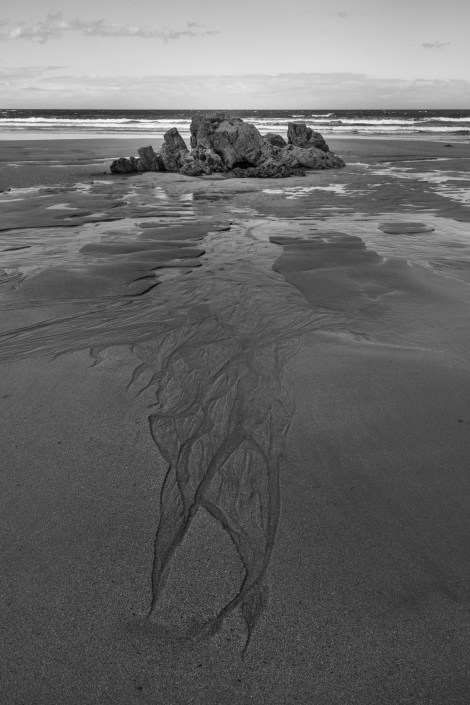 Sand, shapes and rocks at Playa de Penarronda